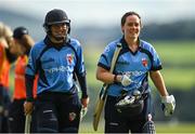 3 August 2020; Typhoons batters Amy Hunter, left, and Laura Delany leave the field following their side's victory during the Women's Super Series match between Typhoons and Scorchers at Oak Hill Cricket Ground in Kilbride, Wicklow. Photo by Seb Daly/Sportsfile