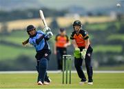 3 August 2020; Amy Hunter of Typhoons plays a shot to score a boundary, watched by Scorchers wicket-keeper Shauna Kavanagh, during the Women's Super Series match between Typhoons and Scorchers at Oak Hill Cricket Ground in Kilbride, Wicklow. Photo by Seb Daly/Sportsfile