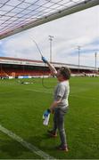 8 August 2020; Shelbourne staff member Con McLeavy sanitises the goalposts ahead of the FAI Women's National League match between Shelbourne and Cork City at Tolka Park in Dublin. Photo by Eóin Noonan/Sportsfile