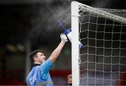 9 August 2020; A member of the the Ryan McBride Brandywell Stadium staff sprays the goalposts at half-time of the SSE Airtricity League Premier Division match between Derry City and Shamrock Rovers at Ryan McBride Brandywell Stadium in Derry. Photo by Stephen McCarthy/Sportsfile