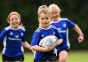 14 August 2020; William Langrell, age 7, in action with Lauren O'Leary, age 8, and Darcie Bailey, age 7, during the Bank of Ireland Leinster Rugby Summer Camp at Gorey in Wexford. Photo by Matt Browne/Sportsfile