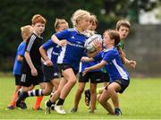 14 August 2020; Darcie Bailey, age 7, in action with Lauren O'Leary, age 8, during the Bank of Ireland Leinster Rugby Summer Camp at Gorey in Wexford. Photo by Matt Browne/Sportsfile