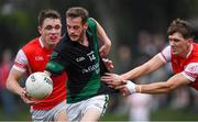 15 August 2020; Jamie Sammon of Parnells is tackled by Michael Fitzsimons, right, and Diarmuid O'Floinn of Cuala during the Dublin County Senior 2 Football Championship Group 2 Round 3 match between Cuala and Parnells at Hyde Park in Glenageary, Dublin. Photo by Piaras Ó Mídheach/Sportsfile