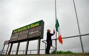 16 August 2020; Groundsman Darragh Bell hoists the Irish tricolour ahead of the Wexford County Senior Hurling Championship Semi-Final match between Glynn-Barntown and Shelmaliers at Chadwicks Wexford Park in Wexford. Photo by Eóin Noonan/Sportsfile