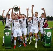 16 August 2020; Mervue United captain Tom Kidd lifts the trophy and celebrates with team-mates following the New Balance FAI Under-17 Cup Final match between Parkvilla and Mervue United at Oscar Traynor Centre in Dublin. Photo by David Fitzgerald/Sportsfile