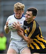 16 August 2020; Liam Ó Conghaile of Mícheál Breathnachs is tackled by Gary Sweeney of Mountbellew/Moylough during the Galway County Senior Football Championship Group 2 match between Mícheál Breathnachs and Mountbellew/Moyloug at Pearse Stadium in Galway. Photo by Ramsey Cardy/Sportsfile