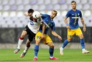 19 August 2020; Michael Duffy of Dundalk in action against Advan Kadusicof NK Celja during the UEFA Champions League First Qualifying Round match between NK Celja and Dundalk at Ferenc Szusza Stadion in Budapest, Hungary. Photo by Vid Ponikvar/Sportsfile