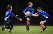 20 August 2020; Billy Brownlie, age 11, in action against JP Lynch, left, age 11, and Evan Quirk, age 12, during the Bank of Ireland Leinster Rugby Summer Camp at Greystones in Wicklow. Photo by Matt Browne/Sportsfile