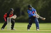 20 August 2020; Kevin O’Brien of Leinster Lightning plays a shot to score a boundary, watched by Munster Reds wicket-keeper Neil Rock, during the 2020 Test Triangle Inter-Provincial Series match between Leinster Lightning and Munster Reds at Pembroke Cricket Club in Dublin. Photo by Seb Daly/Sportsfile