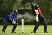 20 August 2020; Jonathan Garth of Munster Reds plays a shot, watched by Leinster Lightning wicket-keeper Lorcan Tucker, during the 2020 Test Triangle Inter-Provincial Series match between Leinster Lightning and Munster Reds at Pembroke Cricket Club in Dublin. Photo by Seb Daly/Sportsfile