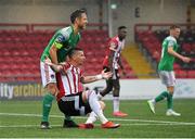 21 August 2020; Alan Bennett of Cork City helps up Adam Hammill of Derry City during the SSE Airtricity League Premier Division match between Derry City and Cork City at the Ryan McBride Brandywell Stadium in Derry. Photo by Seb Daly/Sportsfile