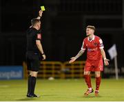 21 August 2020; Mark Byrne of Shelbourne receives a yellow card from referee Rob Harvey during the SSE Airtricity League Premier Division match between Shamrock Rovers and Shelbourne at Tallaght Stadium in Dublin. Photo by Stephen McCarthy/Sportsfile