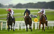 22 August 2020; Mac Swiney, with Kevin Manning up, right, on their way to winning ahead of eventual second, Cadillac, with Shane Foley up, left, and eventual third, Ontario, with Wayne Lordan up, during the Galileo Irish EBF Futurity Stakes at The Curragh Racecourse in Kildare. Photo by David Fitzgerald/Sportsfile