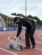 22 August 2020; Official Jacqueline Mulhall sanitises a set of blocks between races during Day One of the Irish Life Health National Senior and U23 Athletics Championships at Morton Stadium in Santry, Dublin. Photo by Sam Barnes/Sportsfile