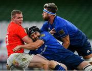 22 August 2020; Chris Farrell of Munster is tackled by Scott Fardy of Leinster supported by team-mamte Caelan Doris during the Guinness PRO14 Round 14 match between Leinster and Munster at the Aviva Stadium in Dublin. Photo by Ramsey Cardy/Sportsfile