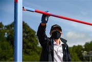 23 August 2020; Official Tim Ahern santises the high jump bar during Day Two of the Irish Life Health National Senior and U23 Athletics Championships at Morton Stadium in Santry, Dublin. Photo by Sam Barnes/Sportsfile