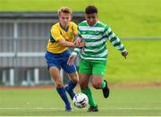 23 August 2020; Godwin Osiebe of Killarney Celtic in action against Anton Frank of Douglas Hall during the FAI Youth Cup Final match between Killarney Celtic and Douglas Hall at Mounthawk Park in Tralee, Kerry. Photo by Michael P Ryan/Sportsfile