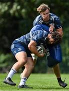 24 August 2020; Michael Milne is tackled by Charlie Ryan during Leinster Rugby squad training at UCD in Dublin. Photo by Ramsey Cardy/Sportsfile