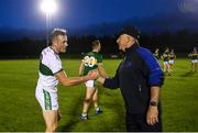 24 August 2020; Ballylinan manager Mick Lillis shakes hands with son and opposing player Kieran Lillis of Portlaoise during the Laois County Senior Football Championship Round 1 match between Ballylinan and Portlaoise GAA at Stradbally GAA in Stradbaly, Laois. Photo by David Fitzgerald/Sportsfile