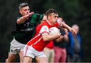 15 August 2020; Niall O'Callaghan of Cuala is tackled by Greame George of Parnells during the Dublin County Senior 2 Football Championship Group 2 Round 3 match between Cuala and Parnells at Hyde Park in Dublin. Photo by Piaras Ó Mídheach/Sportsfile