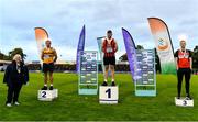 22 August 2020; Athletics Ireland President Georgina Drumm, left, pictured alongside U23 Men's Weight for Height Medallists, from left, Padraig O Callaghan of Leevale AC, Cork, silver, Sean Mockler of Moycarkey Coolcroo AC, Tipperary, gold, Darryl Crawford of Lifford Strabane AC, Donegal,bronze, during Day One of the Irish Life Health National Senior and U23 Athletics Championships at Morton Stadium in Santry, Dublin. Photo by Sam Barnes/Sportsfile