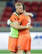27 August 2020; Bohemians goalkeepers James Talbot and Stephen McGuinness embrace following their side's defeat in the UEFA Europa League First Qualifying Round match between Fehervar and Bohemians at MOL Aréna Sóstó in Székesfehérvár, Hungary. Photo by Vid Ponikvar/Sportsfile