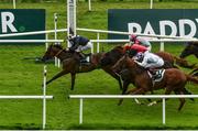 28 August 2020; Laughifuwant, left, with Colin Keane up, passes the post to win the Paddy Power Irish Cambridgeshire at The Curragh Racecourse in Kildare. Photo by Seb Daly/Sportsfile