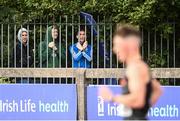 29 August 2020; Olympian and race walking coach Robert Heffernan, centre, watches on from outside the stadium as David Kenny of Farranfore Maine Valley AC, Kerry, competes in the Men's 10,000m Walk event during day three of the Irish Life Health National Senior and U23 Athletics Championships at Morton Stadium in Santry, Dublin. Photo by Sam Barnes/Sportsfile