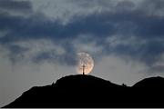 29 August 2020; A general view as the moon passes the Bray Head Cross during the Extra.ie FAI Cup Second Round match between Bray Wanderers and Finn Harps at Carlisle Grounds in Bray, Wicklow. Photo by Harry Murphy/Sportsfile
