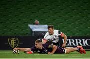 29 August 2020; Scott Penny of Leinster scores his side's second try despite the tackle of Louis Ludik of Ulster  during the Guinness PRO14 Round 15 match between Ulster and Leinster at the Aviva Stadium in Dublin. Photo by Ramsey Cardy/Sportsfile
