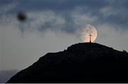 29 August 2020; A general view as the moon passes the Bray Head Cross during the Extra.ie FAI Cup Second Round match between Bray Wanderers and Finn Harps at Carlisle Grounds in Bray, Wicklow. Photo by Harry Murphy/Sportsfile