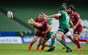 30 August 2020; Andrew Conway of Munster gets a pass away while being tackled by Conor Fitzgerald of Connacht during the Guinness PRO14 Round 15 match between Munster and Connacht at the Aviva Stadium in Dublin. Photo by Brendan Moran/Sportsfile