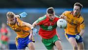 30 August 2020; Carl Keeley of Ballymun Kickhams in action against Jonny Cooper, left, and Glen O'Reilly of Na Fianna during the Dublin County Senior Football Championship Quarter-Final match between Ballymun Kickhams and Na Fianna at Parnell Park in Dublin. Photo by Piaras Ó Mídheach/Sportsfile