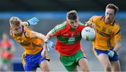 30 August 2020; Carl Keeley of Ballymun Kickhams in action against Jonny Cooper, left, and Glen O'Reilly of Na Fianna during the Dublin County Senior Football Championship Quarter-Final match between Ballymun Kickhams and Na Fianna at Parnell Park in Dublin. Photo by Piaras Ó Mídheach/Sportsfile