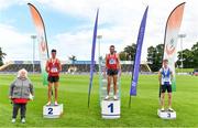 30 August 2020; Athletics Ireland President Georgina Drumm, left, alongside Men's 3000m Steeplechase medallists, from left, Mark Hanrahan of Ennis Track AC, Clare, silver, Rory Chesser of Ennis Track AC, Clare, gold, and Joseph Haynes of Armagh AC, bronze,  pretend to acknowledge the crowd during day four of the Irish Life Health National Senior and U23 Athletics Championships at Morton Stadium in Santry, Dublin. Photo by Sam Barnes/Sportsfile