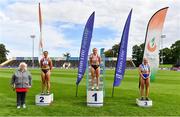 30 August 2020; Athletics Ireland President Georgina Drumm, left, alongside Women's 100m Hurdles medallists, from left, Lilly-Ann O'Hora of Dooneen AC, Limerick, silver, Sarah Quinn of St. Colmans South Mayo AC, gold, and Molly Scott of St. Laurence O'Toole AC, Carlow, bronze,  during day four of the Irish Life Health National Senior and U23 Athletics Championships at Morton Stadium in Santry, Dublin. Photo by Sam Barnes/Sportsfile