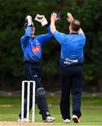 1 September 2020; Lorcan Tucker of Leinster Lightning, left, celebrates with James Newland after catching out Jeremy Lawlor of Munster Reds during the 2020 Test Triangle Inter-Provincial Series match between Munster Reds and Leinster Lightning at The Mardyke Cricket Grounds in Cork. Photo by Sam Barnes/Sportsfile