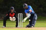 1 September 2020; Tyrone Kane of Leinster Lightning plays a shot watched by Neil Rock of Munster Reds during the 2020 Test Triangle Inter-Provincial Series match between Munster Reds and Leinster Lightning at The Mardyke Cricket Grounds in Cork. Photo by Sam Barnes/Sportsfile