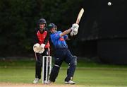 1 September 2020; Curtis Campher of Leinster Lightning his a six watched by Neil Rock of Munster Reds during the 2020 Test Triangle Inter-Provincial Series match between Munster Reds and Leinster Lightning at The Mardyke Cricket Grounds in Cork. Photo by Sam Barnes/Sportsfile