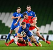 4 September 2020; Garry Ringrose of Leinster is tackled by Craig Casey, left, and Shane Daly of Munster during the Guinness PRO14 Semi-Final match between Leinster and Munster at the Aviva Stadium in Dublin. Photo by Ramsey Cardy/Sportsfile