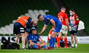 4 September 2020; Jordan Larmour of Leinster is checked on by team-mate Jonathan Sexton as he receives medical attention during the Guinness PRO14 Semi-Final match between Leinster and Munster at the Aviva Stadium in Dublin. Photo by Brendan Moran/Sportsfile
