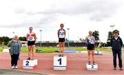 5 September 2020; Athletics Ireland President Georgina Drumm, left, alongside Women's 3000m Steeplechase medallists, from left, Sarah Gilhooley of Galway City Harriers AC, silver, Cara McNally of Lusk AC, Dublin, gold, and Niamh McDonald of Ballyroan Abbeyleix and District AC, bronze, during the Irish Life Health National Junior Track and Field Championships at Morton Stadium in Santry, Dublin. Photo by Sam Barnes/Sportsfile