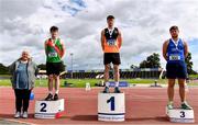 5 September 2020; Athletics Ireland President Georgina Drumm, left, alongside Junior Men's Discus Medallists, from left, Adam Sheridan of Westport AC, Mayo, silver, Sean Carolan of Nenagh Olympic AC, Tipperary, gold, and Eoghan Murphy of Tara AC, Meath, bronze, during the Irish Life Health National Junior Track and Field Championships at Morton Stadium in Santry, Dublin. Photo by Sam Barnes/Sportsfile