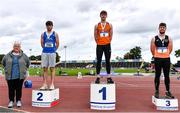 5 September 2020; Athletics Ireland President Georgina Drumm, left, alongside Junior Men's Long Jump medallists, from left, Luke O'Carroll of Tralee Harriers AC, Kerry, silver, Joseph Mc Evoy of Nenagh Olympic AC, Tipperary, gold, and Darragh Miniter of Nenagh Olympic AC, Tipperary, bronze, during the Irish Life Health National Junior Track and Field Championships at Morton Stadium in Santry, Dublin. Photo by Sam Barnes/Sportsfile