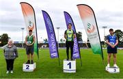 5 September 2020; Athletics Ireland President Georgina Drumm, left, alongside Junior Men's Weight for Distance medallists, from left, Azuolas Varnili of Templemore AC, Tipperary, silver, Robert Higgins of Na Fianna AC, Meath, gold, Eoghan Murphy of Tara AC, Meath, bronze, during the Irish Life Health National Junior Track and Field Championships at Morton Stadium in Santry, Dublin. Photo by Sam Barnes/Sportsfile