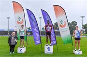 5 September 2020; Athletics Ireland President Georgina Drumm, left, alongside Junior Men's 200m medallists, from left, Michael Farrelly of Raheny Shamrock AC, Dublin, silver, Charles Okafor of Mullingar Harriers AC, Westmeath, gold, and Aaron Keane of Tullamore Harriers AC, Offaly, bronze, during the Irish Life Health National Junior Track and Field Championships at Morton Stadium in Santry, Dublin. Photo by Sam Barnes/Sportsfile