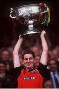 15 September 1991; Down captain Paddy O'Rourke lifts the Sam Maguire cup after the GAA All-Ireland Senior Football Final match between Down and Meath at Croke Park in Dublin. Photo by Ray McManus/Sportsfile