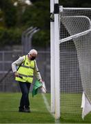 12 September 2020; Martin Keane sanitises the green flag beside the goal posts before the Clare County Senior Hurling Championship Semi-Final match between Sixmilebridge and Eire Óg at Cusack Park in Ennis, Clare. Photo by Ray McManus/Sportsfile