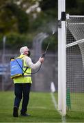 12 September 2020; Martin Keane sanitises the goal posts before the Clare County Senior Hurling Championship Semi-Final match between Sixmilebridge and Eire Óg at Cusack Park in Ennis, Clare. Photo by Ray McManus/Sportsfile