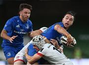 12 September 2020; James Lowe of Leinster is tackled by Michael Lowry, 15, and Jacob Stockdale of Ulster during the Guinness PRO14 Final match between Leinster and Ulster at the Aviva Stadium in Dublin. Photo by Ramsey Cardy/Sportsfile